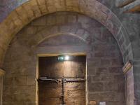 Plateau de Ganagobie (04)  Monastère ND de Ganagobie - La porte vue de l'intérieur. Au centre, le bénitier ...